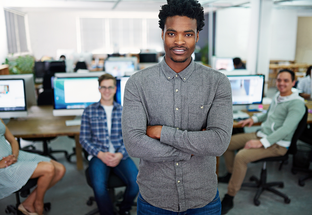 Sudatel employees standing together and smiling